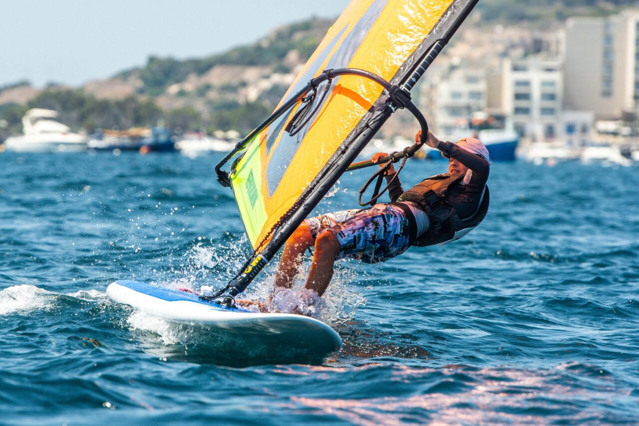 A windsurfer racing in St Paul’s Bay during the Yachting Malta Windsurfing Festival