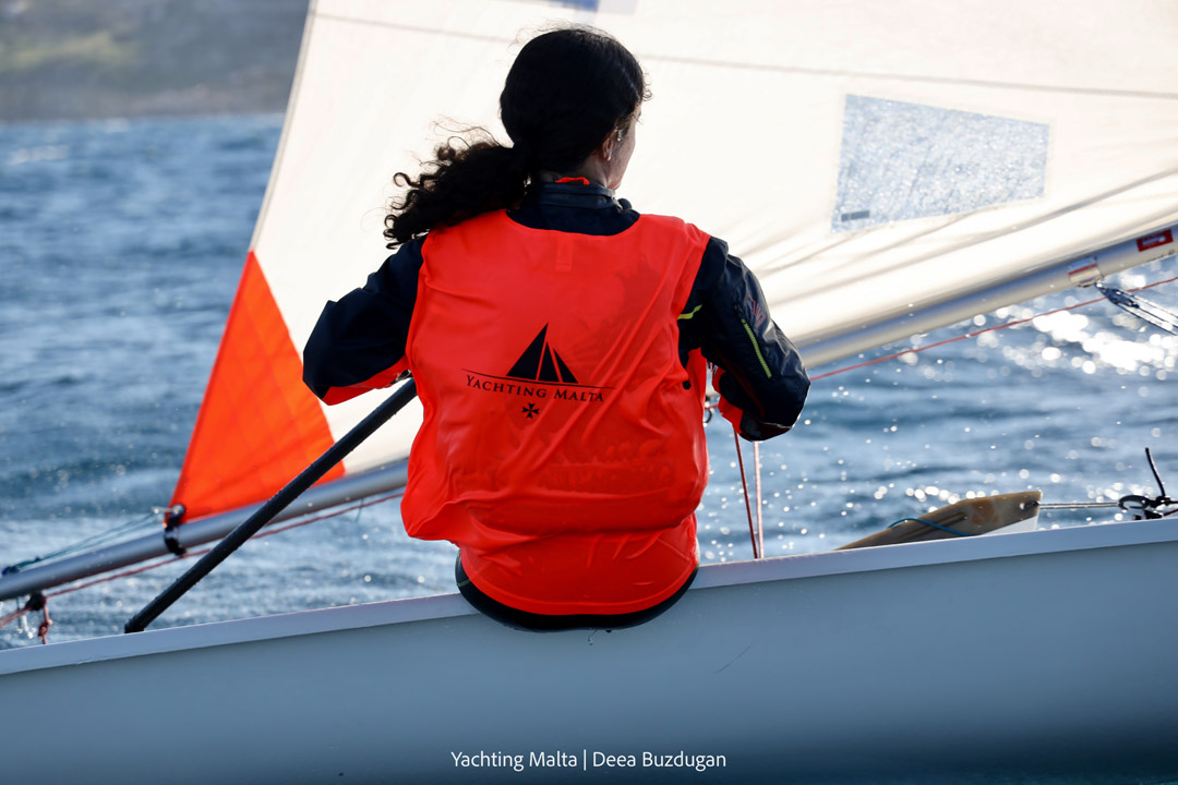An Optimist sailor in Mellieħa Bay during the Euromed International Regatta