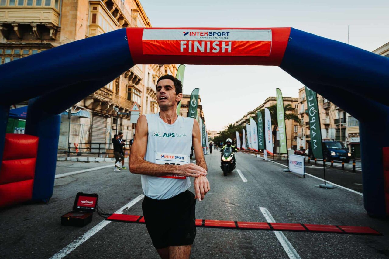 A runner approaches the finish arch on Valletta’s waterfront