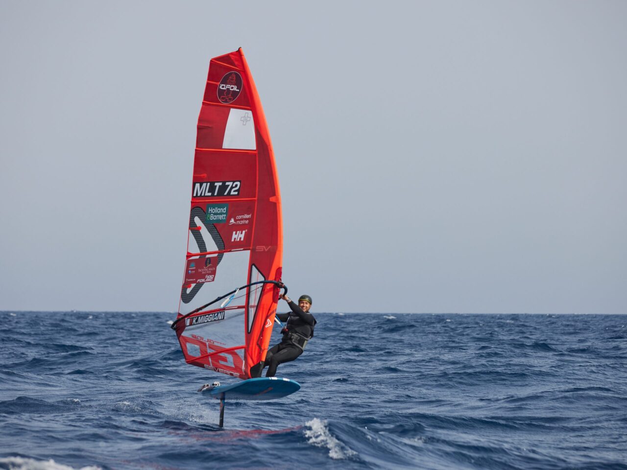 Karl Miggiani foiling on his windsurfer off Malta