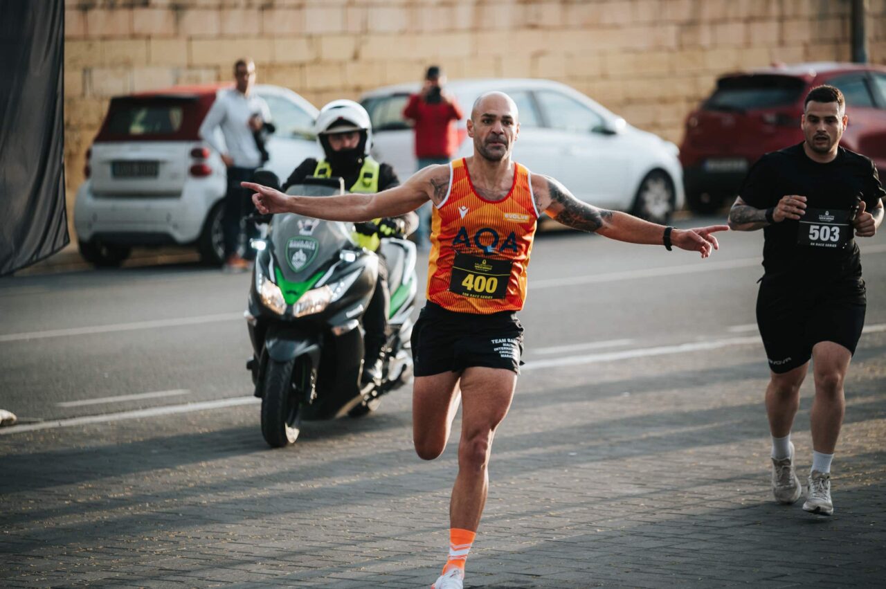A runner crossing the line at the Maqluba Edition
