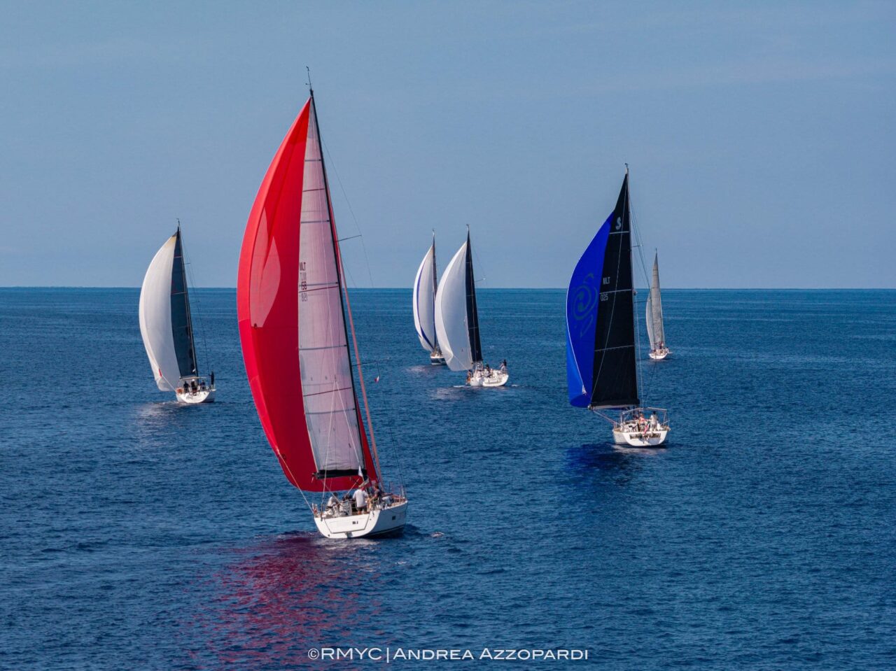 Keelboats under spinnaker at the Ramla Bay Weekend Regatta